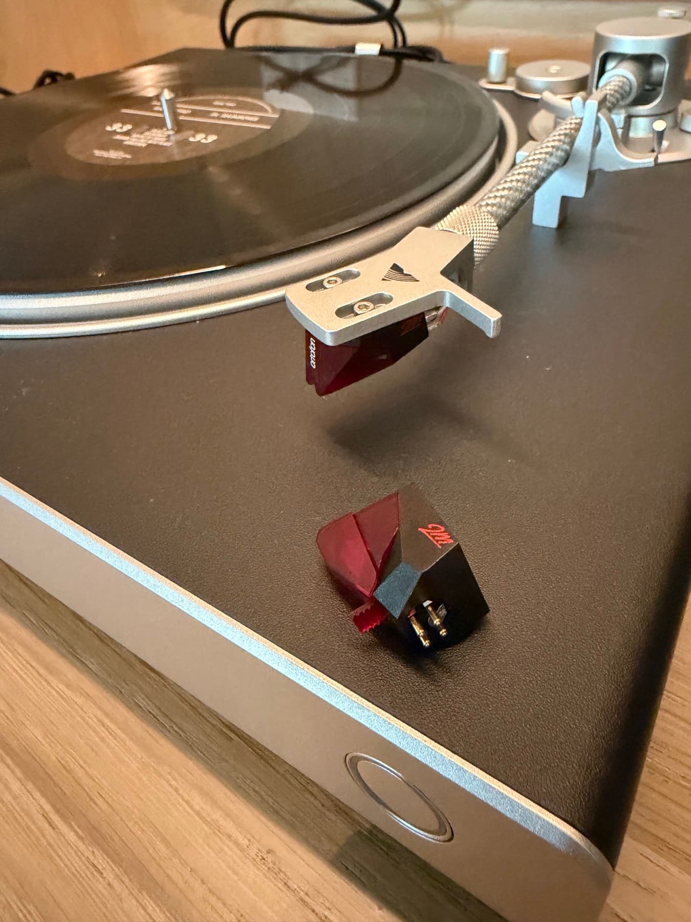 Close-up of an audiophile turntable cartridge during setup and service in River Oaks