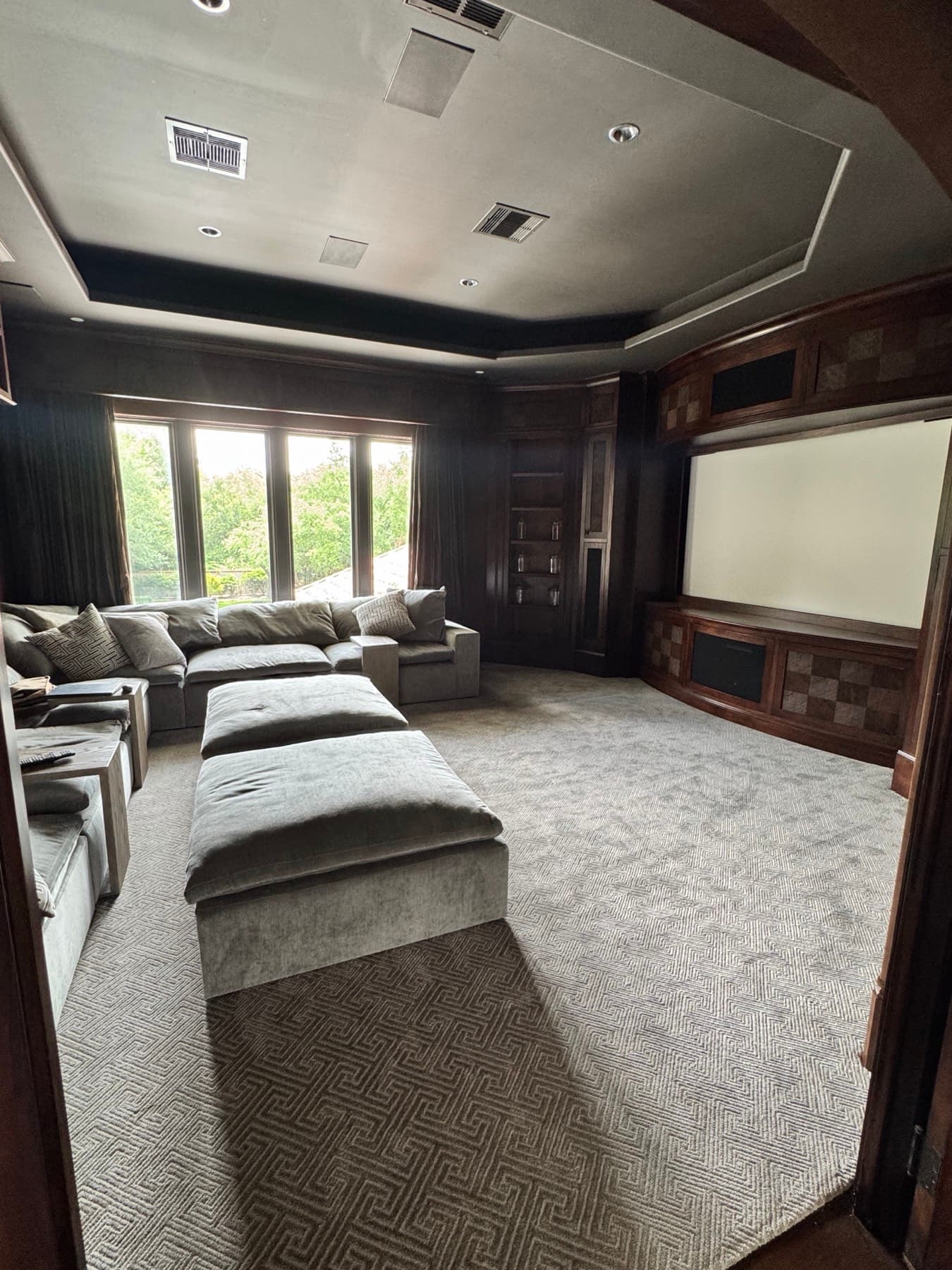 Luxury media room with sectional seating and integrated AV